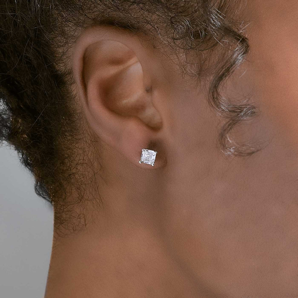 Model wearing Jewellers District's Asscher-Cut Diamond Stud Earrings in 14k White Gold, Lab-grown 1.40 ctw, VS2+/ F+ #2