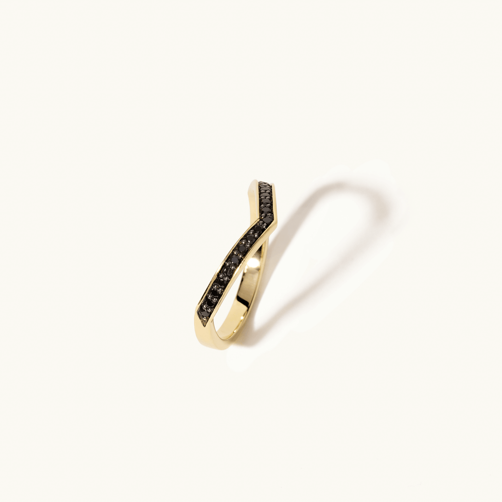 Angled view of Jewellers District's V-Shaped Gold Ring With Black Spinels in 10k Yellow Gold