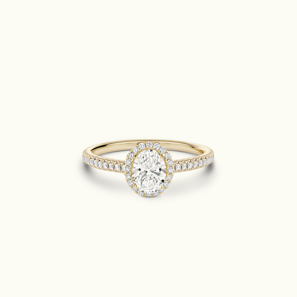 Jewellers District's Diamond Halo Engagement Ring in 14k Yellow Gold, Oval