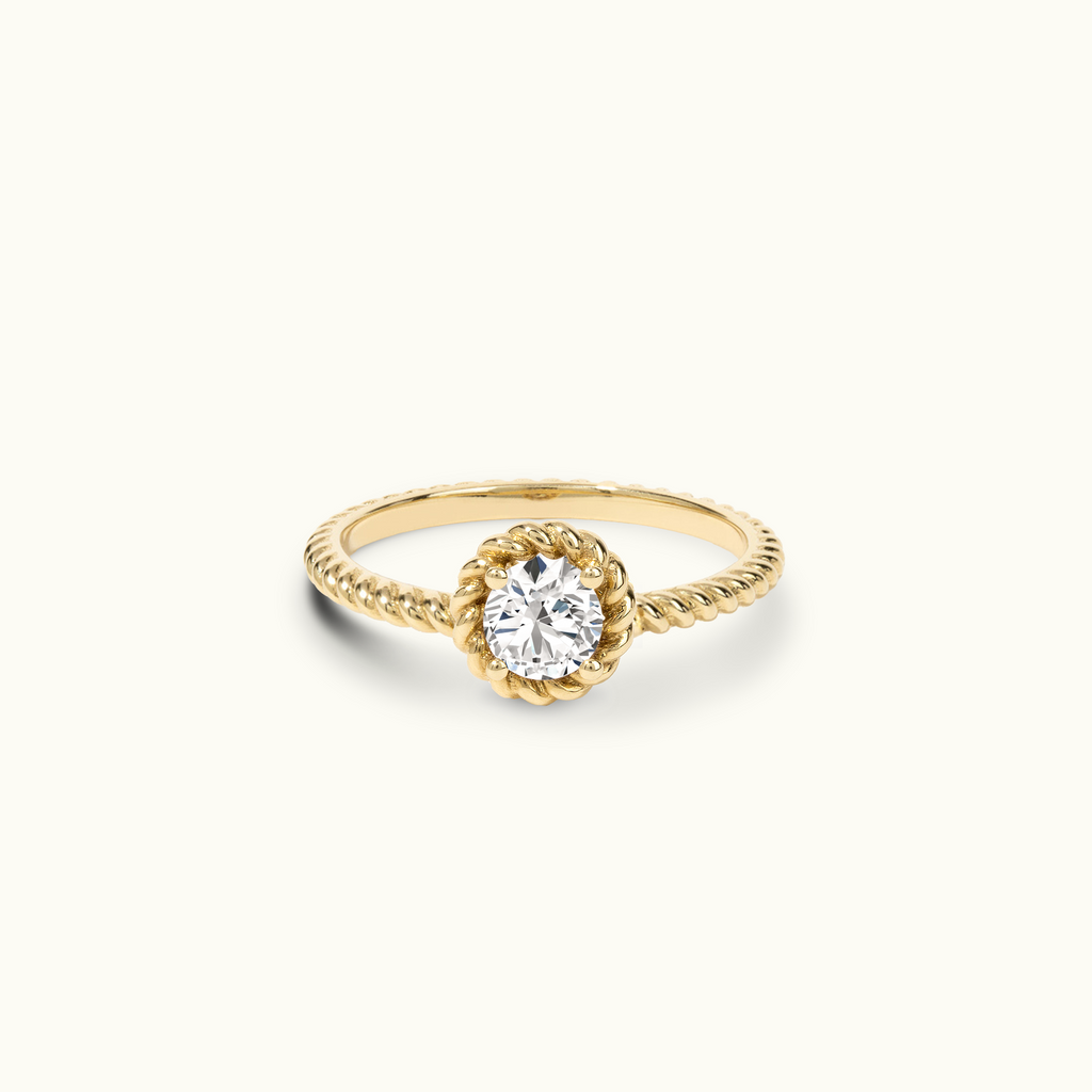 Jewellers District's Twist Diamond Engagement Ring in 14k Yellow Gold, Round