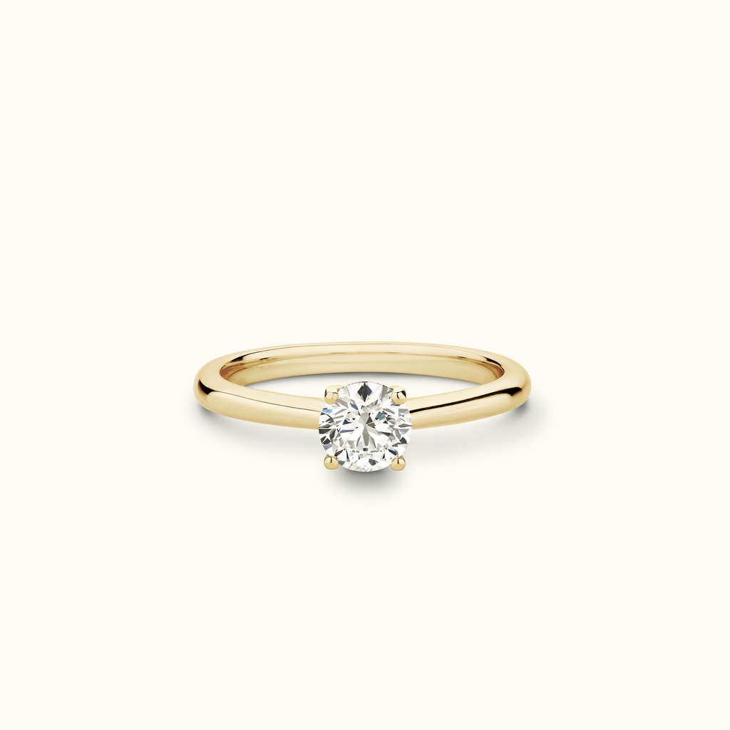 Jewellers District's Solitaire Diamond Engagement Ring with Cathedral-Setting in 14k Yellow Gold, Round