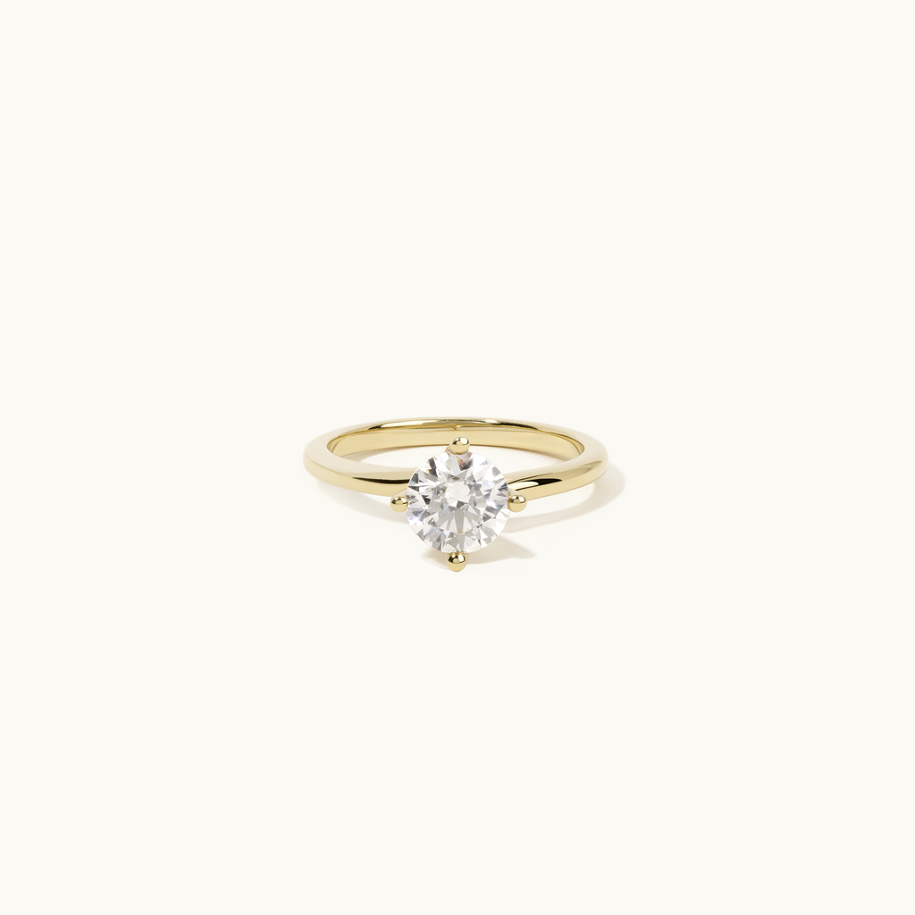 Jewellers District's Solitaire Diamond Engagement Ring with Twist Setting in 14k Yellow Gold, Round