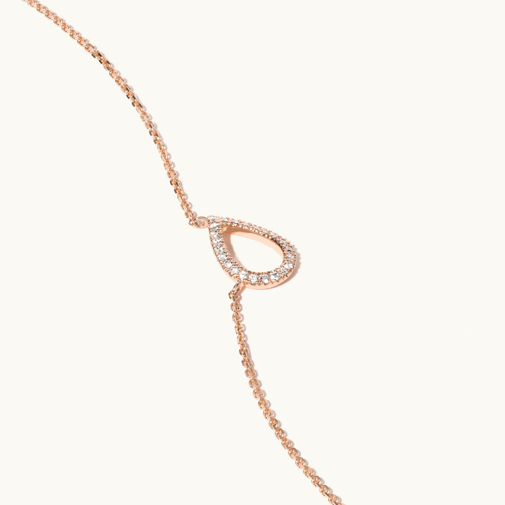 Angled view of Jewellers District's Pear Diamond Pavé Pendant Necklace in 10k Rose Gold