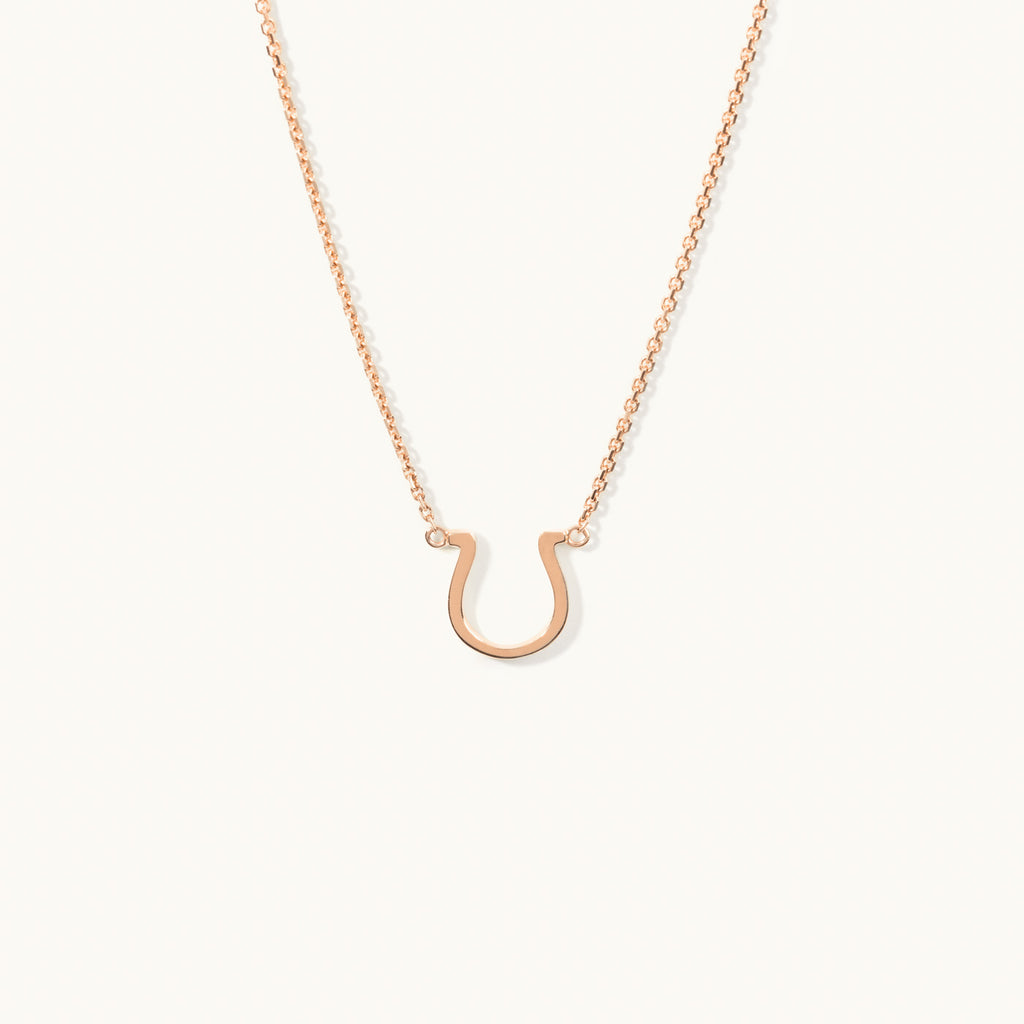 Jewellers District's Gold Horseshoe Pendant Necklace in 14k Rose Gold