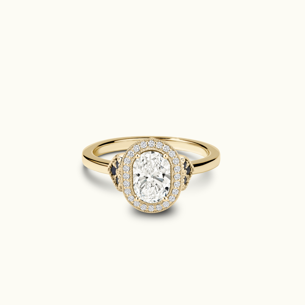 Jewellers District's Diamond Halo Engagement Ring with Side Diamonds and Milgrain in 14k Yellow Gold, Oval