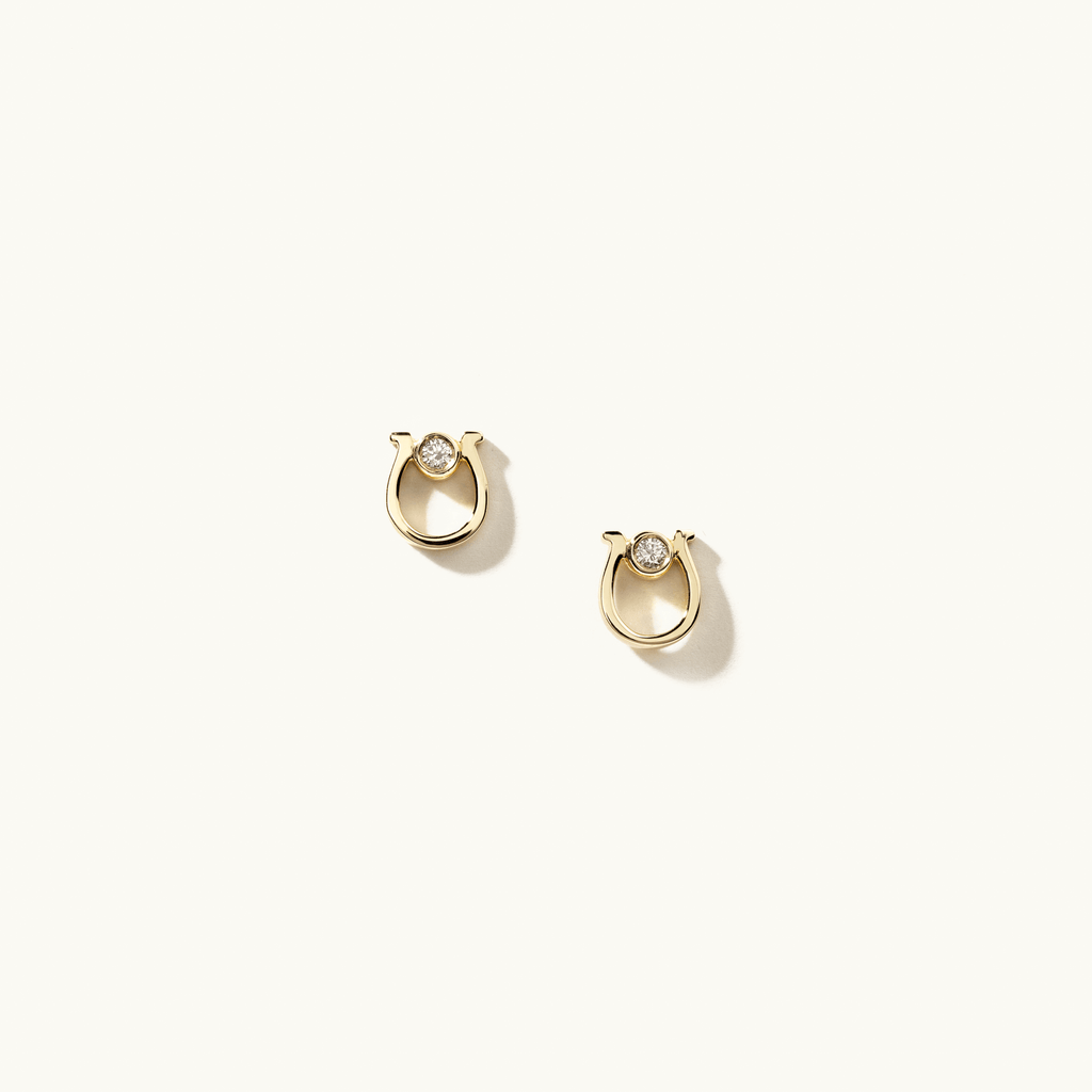 Face view of Jewellers District's Horseshoe Diamond Stud Earrings in 14k Yellow Gold