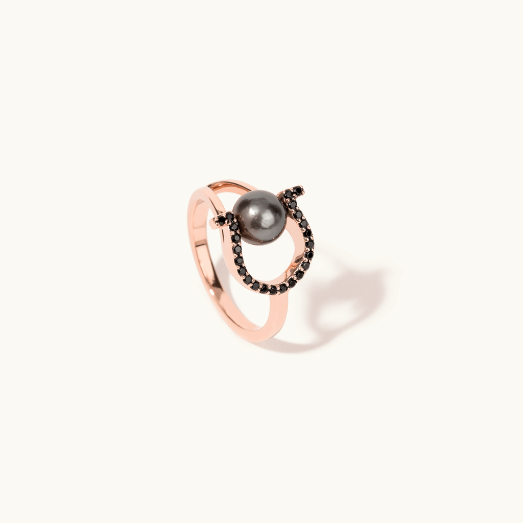 Angled view of Jewellers District's Horseshoe Tahitian Pearl Ring with Black Spinels in 14k Rose Gold