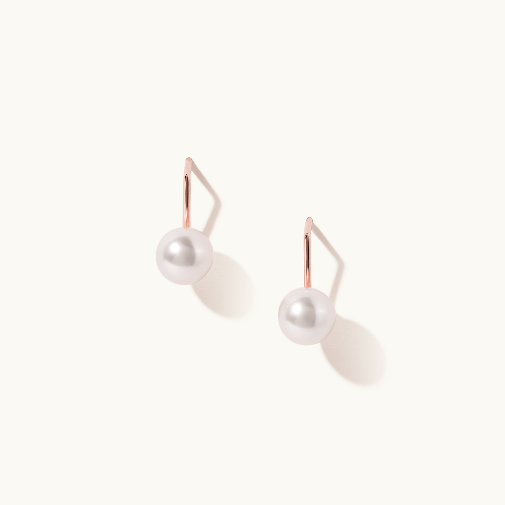 Face view of Jewellers District's Freshwater Pearl Drop Earrings in 14k Rose Gold