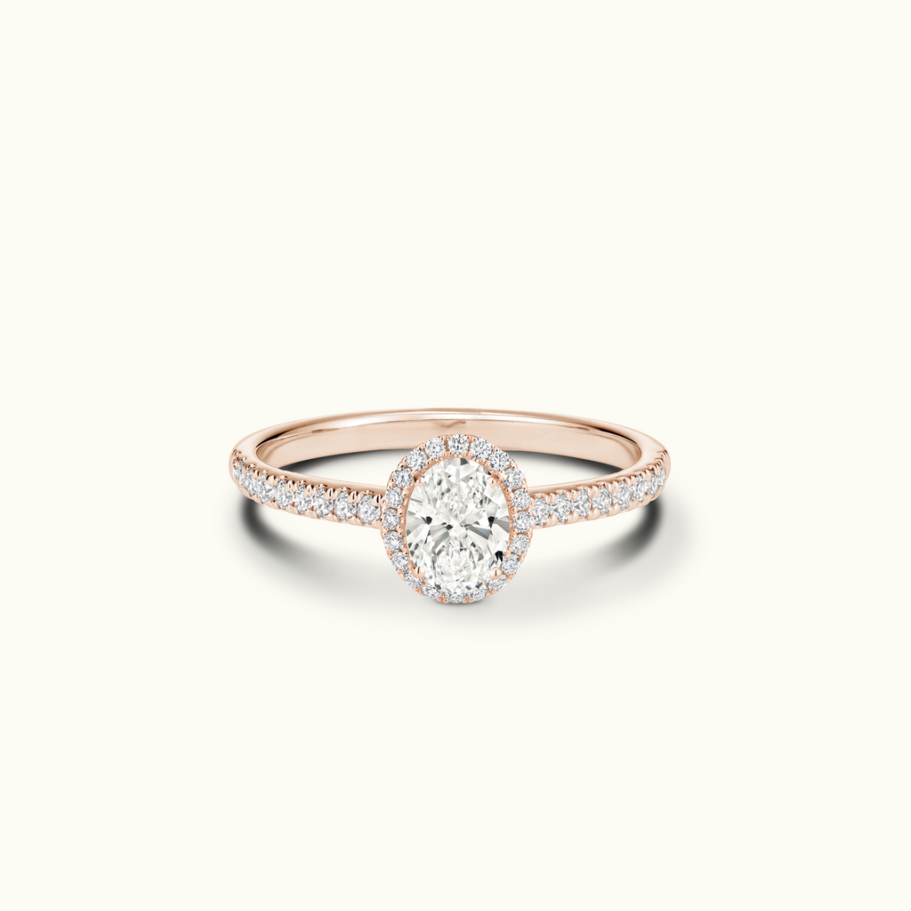 Jewellers District's Diamond Halo Engagement Ring with Diamond Bridge in 14k Rose Gold, Oval