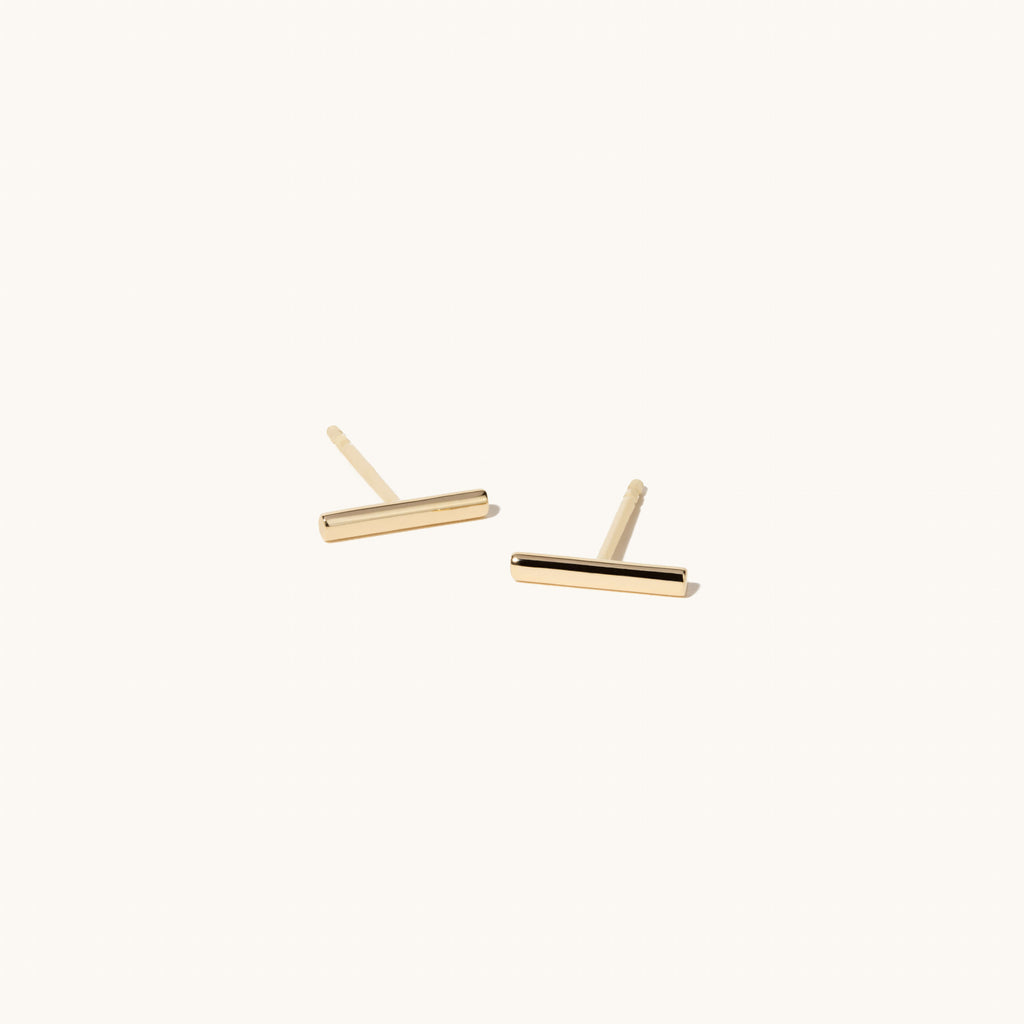 Angled view of Jewellers District's Gold Bar Stud Earrings in 14k Yellow Gold