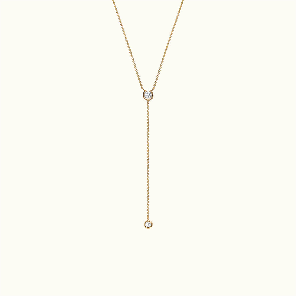 Face view of Jewellers District's Bezel-Set Round Diamonds Lariat Necklace in 14k Yellow Gold