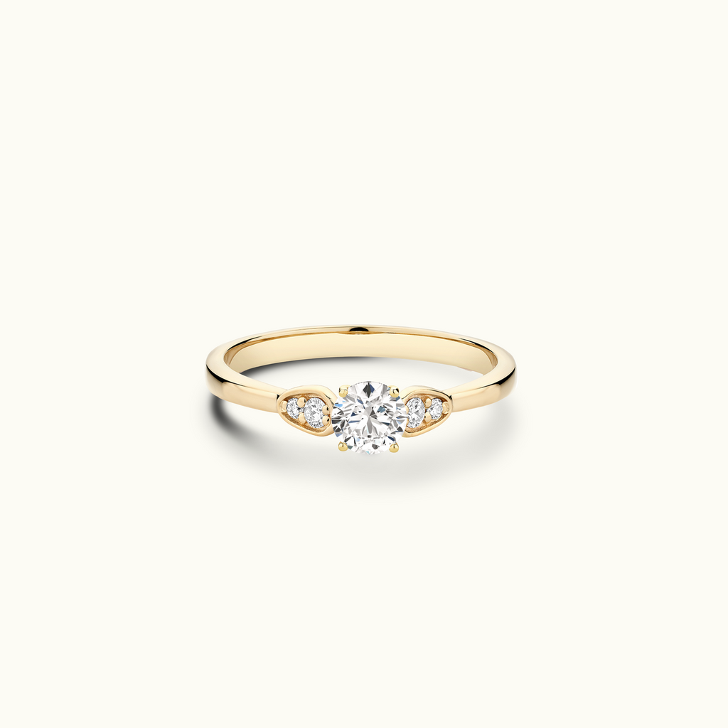 Jewellers District's Diamond Engagement Ring with Side Stone Detail in 14k Yellow Gold, Round