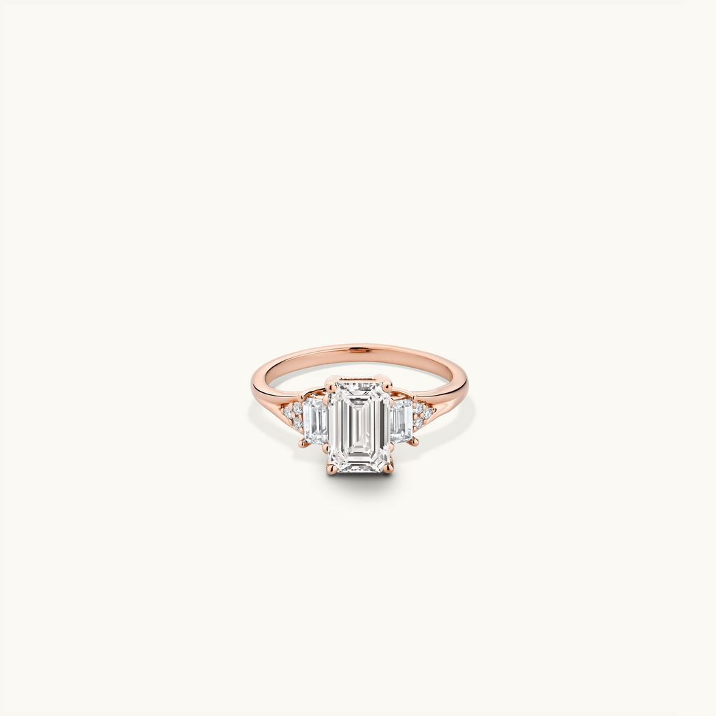 Jewellers District's Three-Stone Engagement ring with Cluster Side Diamonds in 14k Rose Gold, Emerald