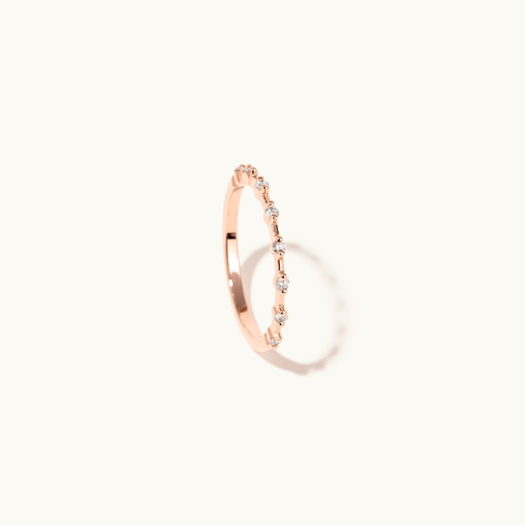 Profile view of Jewellers District's Two-Prong Diamond Wedding Ring in 14k Rose Gold