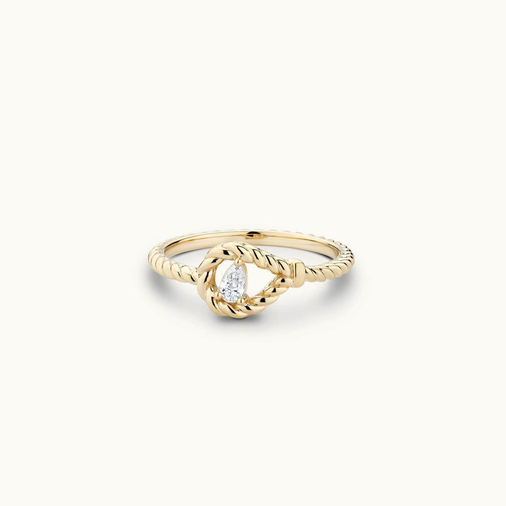 Jewellers District's Twist Ring with Pear Cut Diamond in 14k Yellow Gold