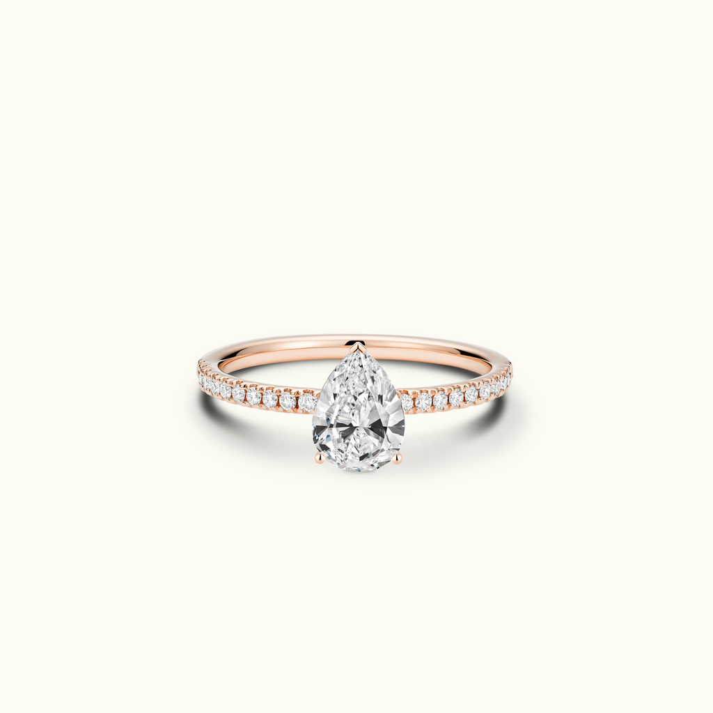 Jewellers District's Diamond Engagement Ring with Signature Knot-Basket and Diamond Band in 14k Rose Gold, Pear