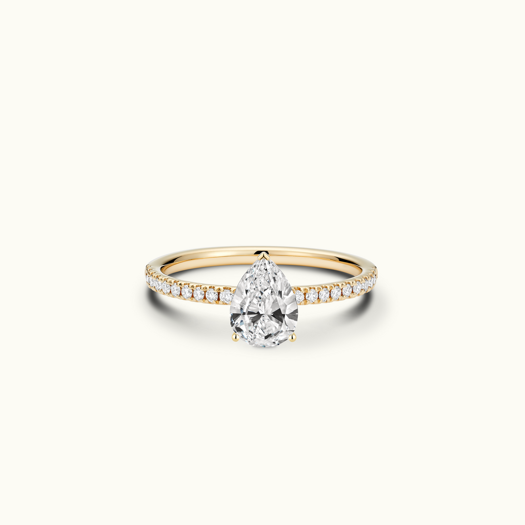 Jewellers District's Diamond Engagement Ring with Signature Knot-Basket and Diamond Band in 14k Yellow Gold, Pear