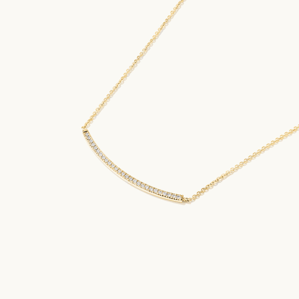 Profile view of Jewellers District's Curved Diamond Bar Necklace in 14k Yellow Gold