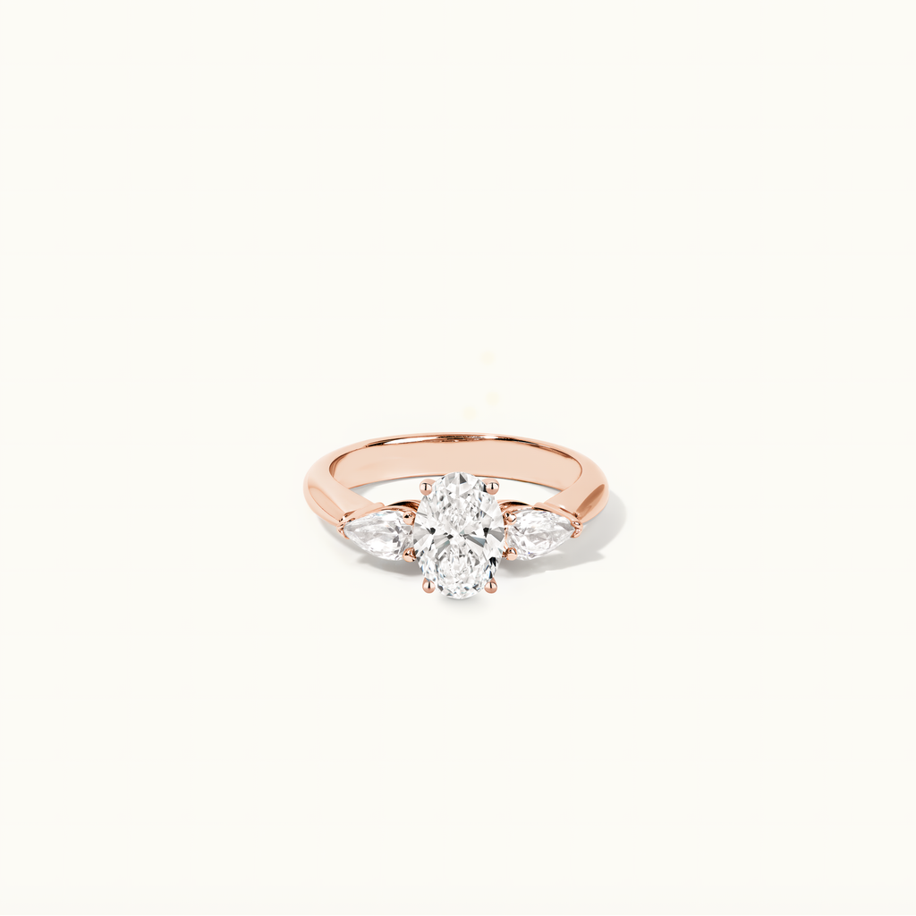 Jewellers District's Three-Stone Diamond Engagement Ring with Side Pear Diamonds in 14k Rose Gold, Oval