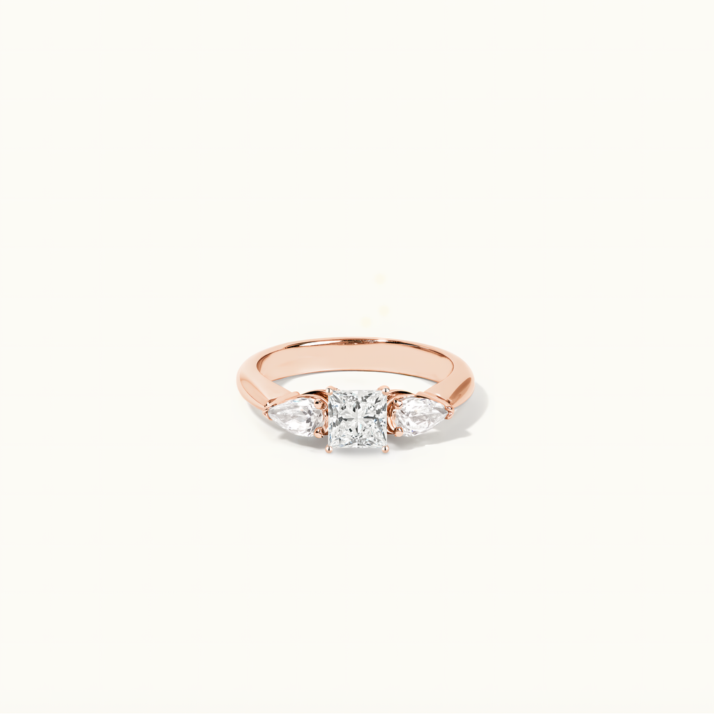 Jewellers District's Three-Stone Diamond Engagement Ring with Side Pear Diamonds in 14k Rose Gold, Princess