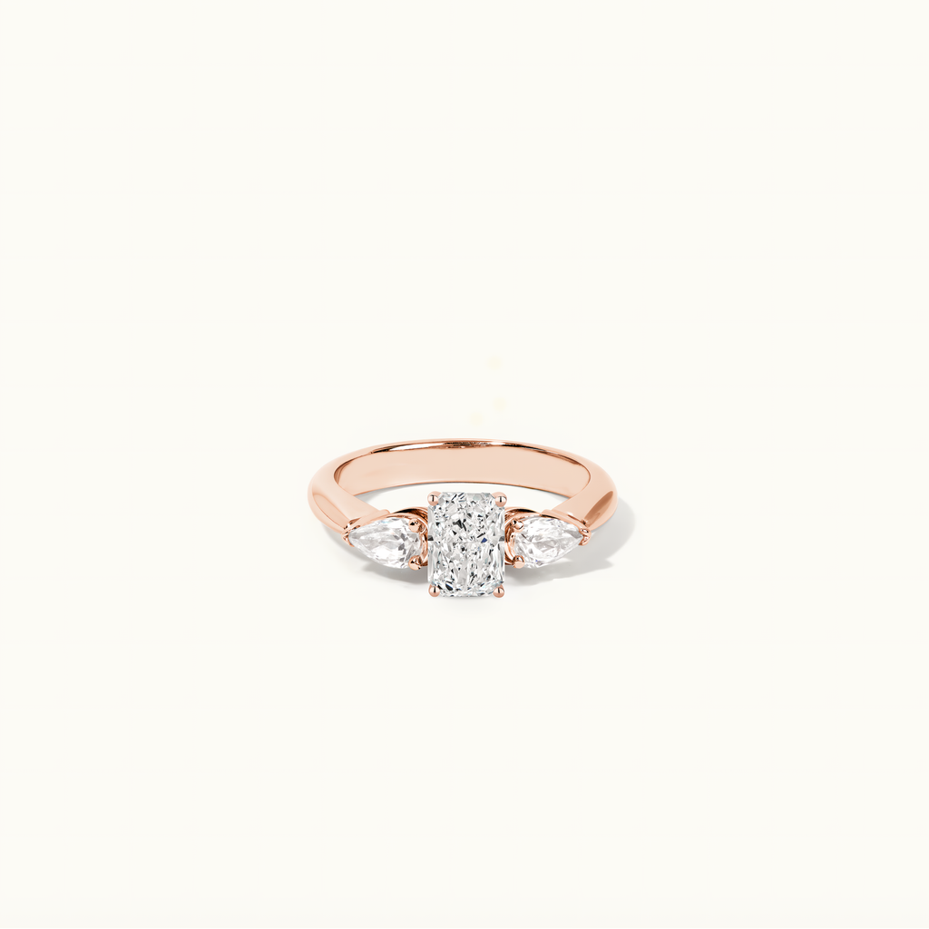 Jewellers District's Three-Stone Diamond Engagement Ring with Side Pear Diamonds in 14k Rose Gold, Radiant