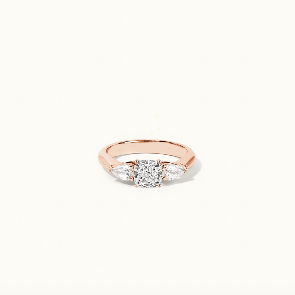 Jewellers District's Three-Stone Diamond Engagement Ring with Side Pear Diamonds in 14k Rose Gold, Cushion