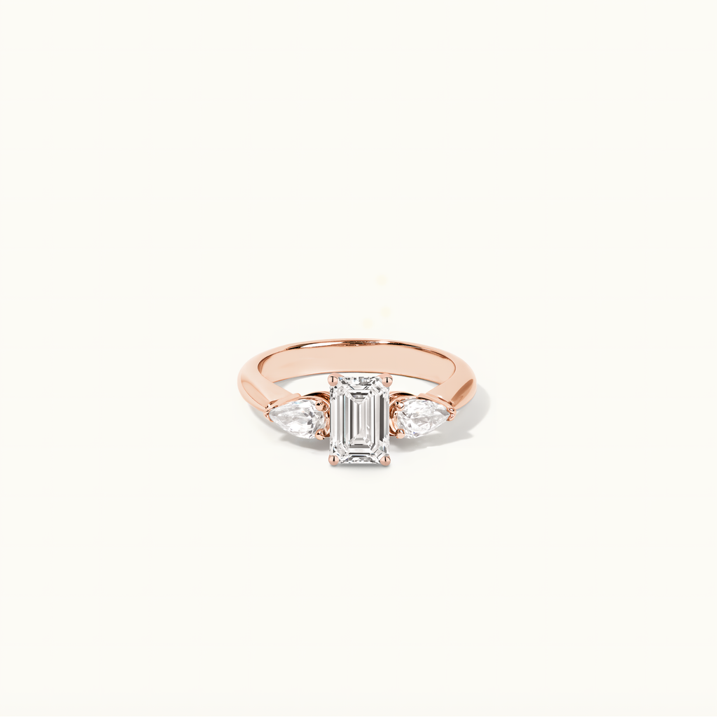 Jewellers District's Three-Stone Diamond Engagement Ring with Cathedral Setting in 14k Rose Gold, Emerald