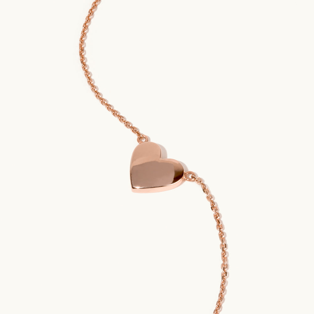 Angled view of Jewellers District's Heart of Gold Pendant Necklace in 14k Rose Gold