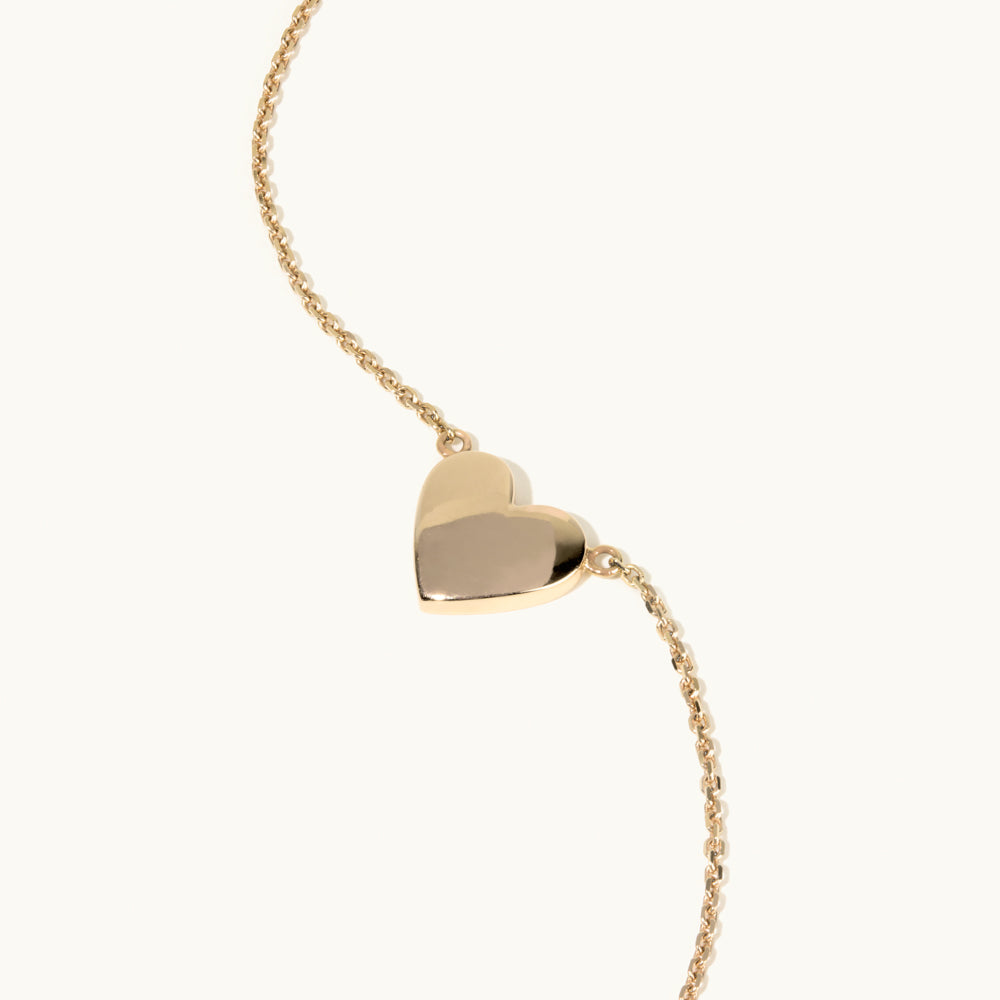 Angled view of Jewellers District's Heart of Gold Pendant Necklace in 14k Yellow Gold