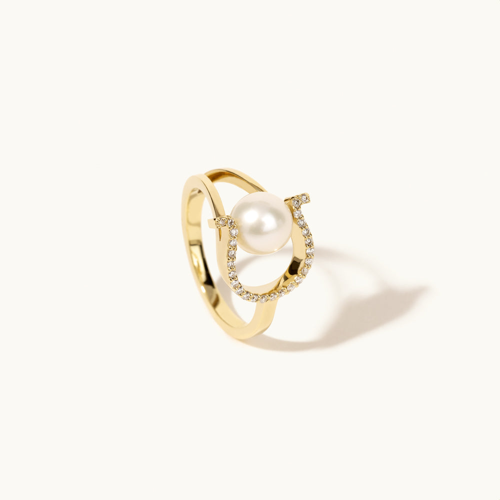 Angled view of Jewellers District's Horseshoe Freshwater Pearl Ring with Diamond Pavé in 14k Yellow Gold