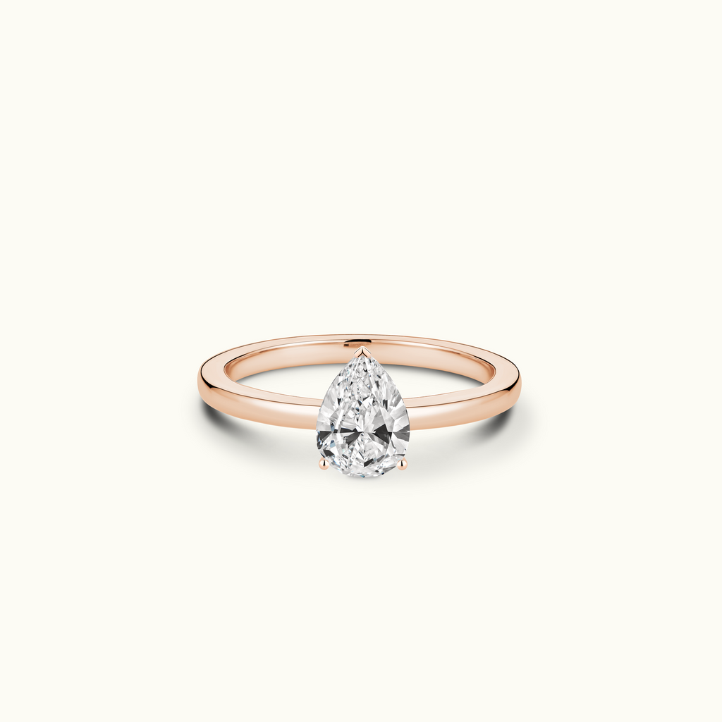 Jewellers District's Diamond Engagement Ring with Signature Knot-Basket and Diamond Prongs in 14k Rose Gold, Pear