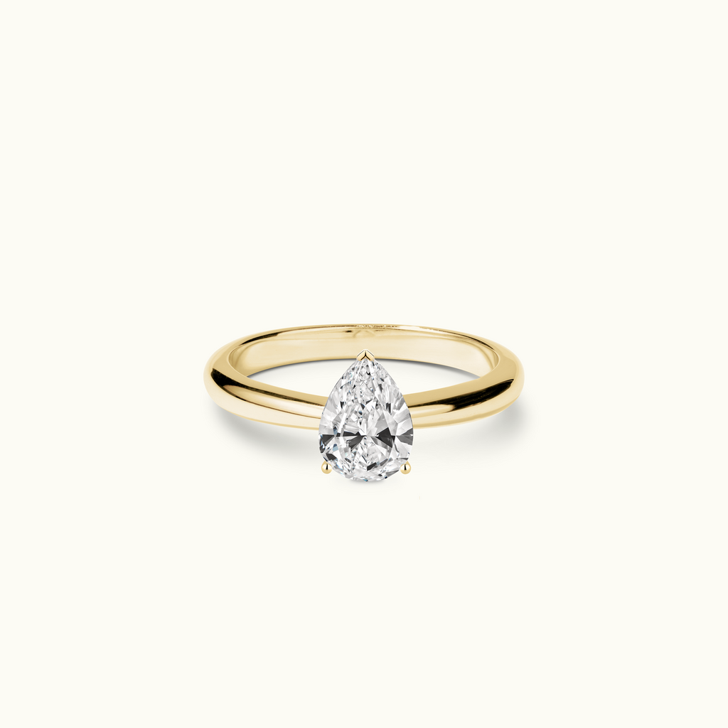 Jewellers District's Diamond Engagement Ring with Tapered Band in 14k Yellow Gold, Pear