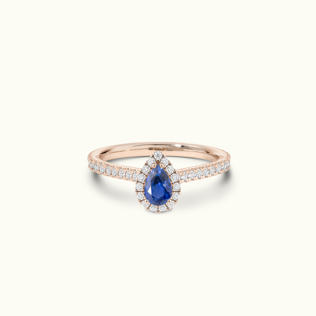 Jewellers District's Cathedral-Setting Royal Sapphire Halo Engagement Ring with Diamond Band in 14k Rose Gold, Pear