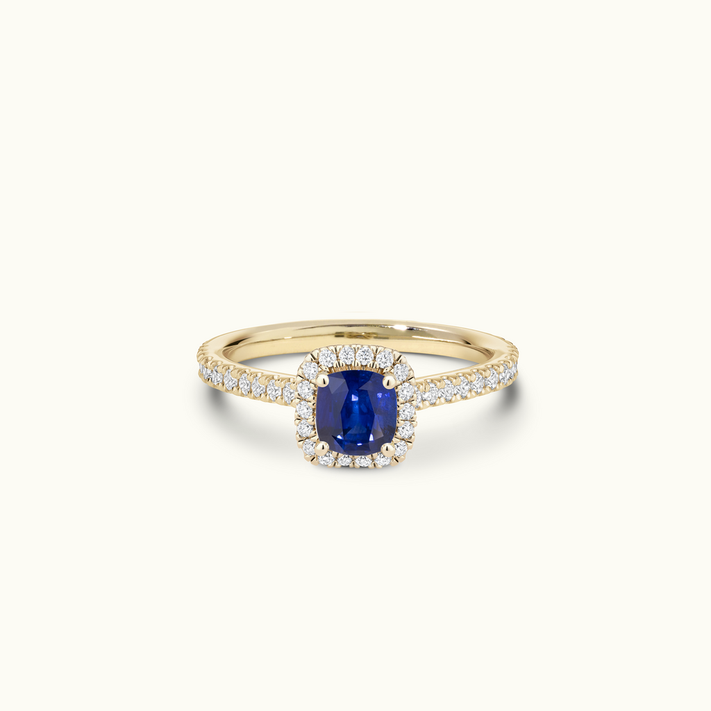 Jewellers District's Cathedral-Setting Royal Sapphire Halo Engagement Ring with Diamond Band in 14k Yellow Gold, Cushion