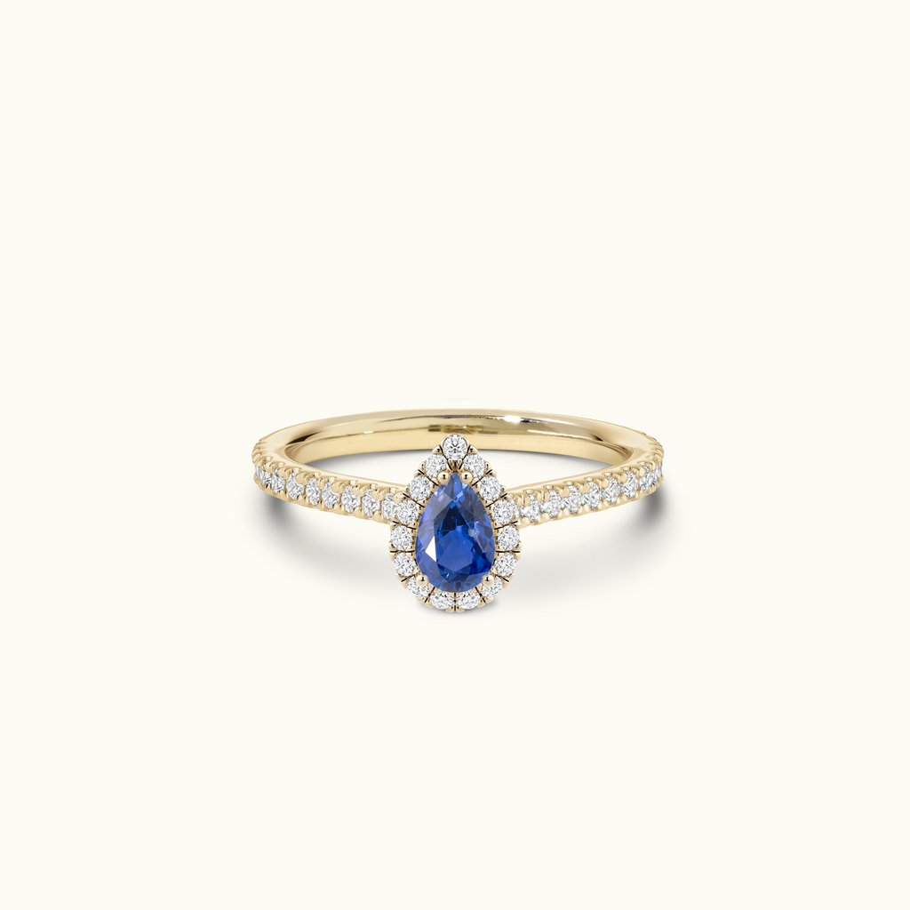 Jewellers District's Cathedral-Setting Royal Sapphire Halo Engagement Ring with Diamond Band in 14k Yellow Gold, Pear