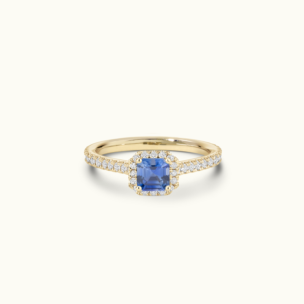 Jewellers District's Cathedral-Setting Royal Sapphire Halo Engagement Ring with Diamond Band in 14k Yellow Gold, Asscher