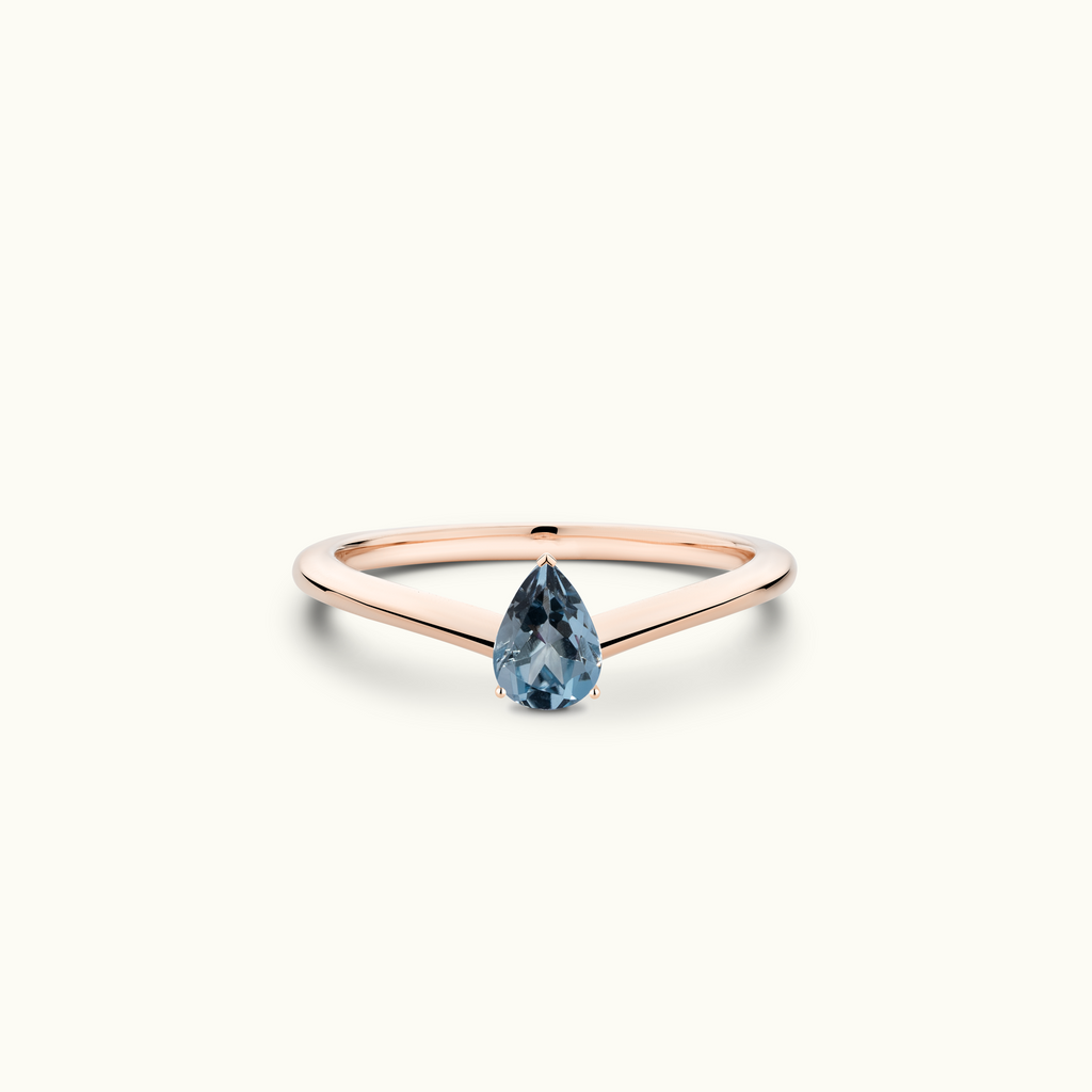 Model wearing Jewellers District's V-Shaped Pear Cut Aquamarine Engagement Ring in 14k Rose Gold, Pear