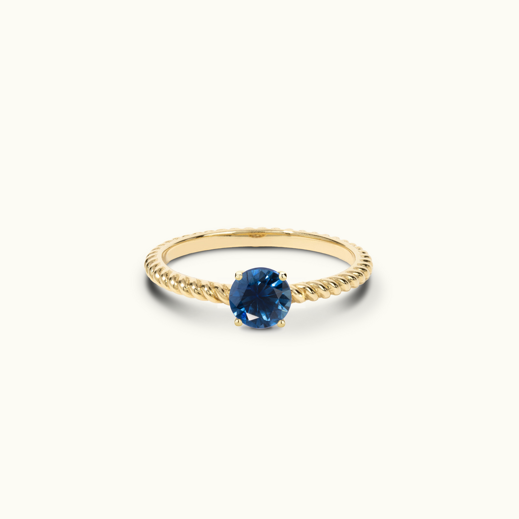 Jewellers District's Twist Royal Sapphire Engagement Ring in 14k Yellow Gold, Round