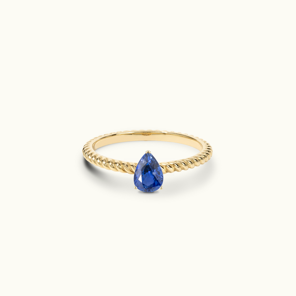 Jewellers District's Twist Royal Sapphire Engagement Ring in 14k Yellow Gold, Pear