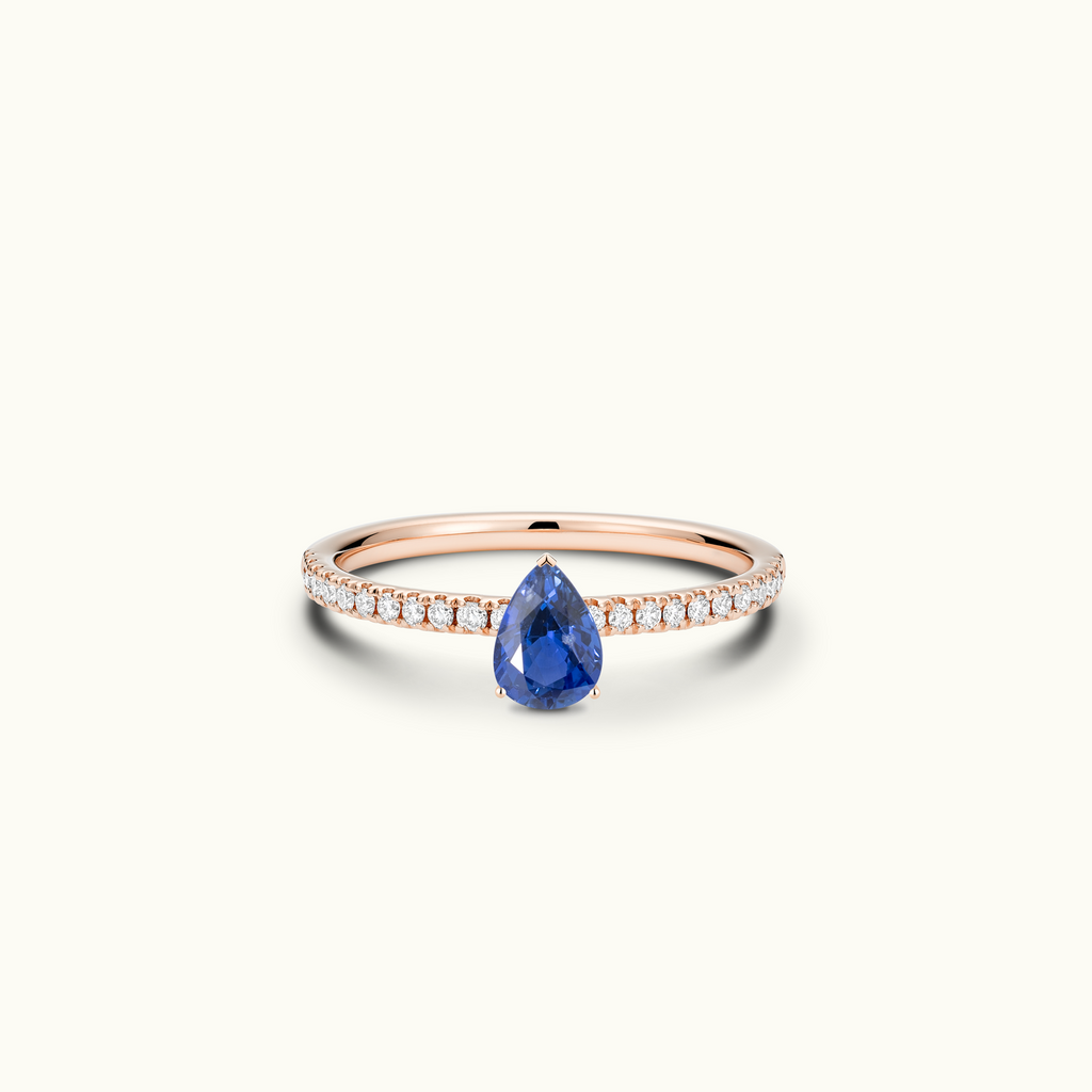 Jewellers District's Royal Sapphire Engagement Ring with Signature Knot-Basket and Diamond Band in 14k Rose Gold, Pear