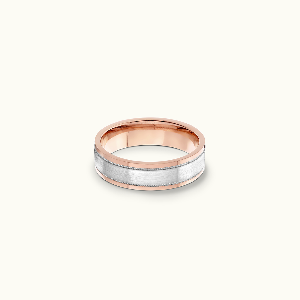 Face view of Jewellers District's Flat Two-Tone Beveled Wedding Ring in 14k Rose Gold, Band: 5mm