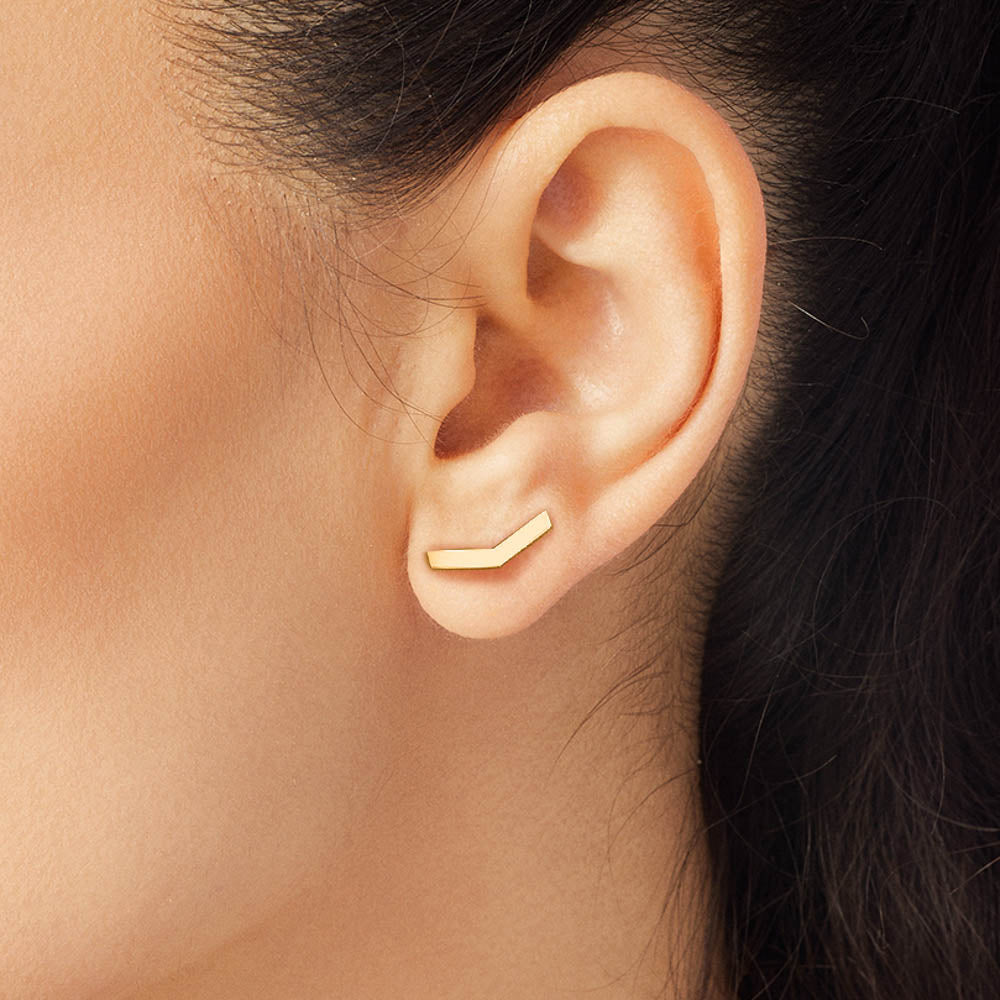 Model wearing Jewellers District's V-Shaped Gold Stud Earrings in 10k Yellow Gold #5