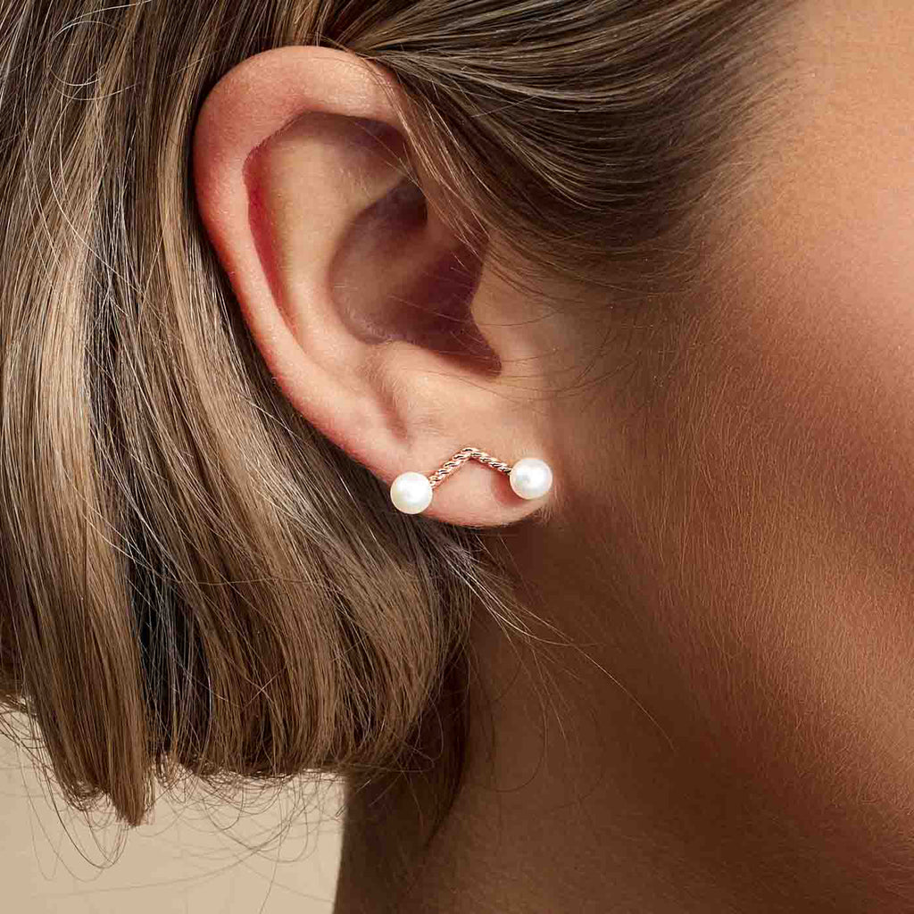 Model wearing Jewellers District's Cherry Stem Freshwater Pearl Earrings in 14k Rose Gold #3