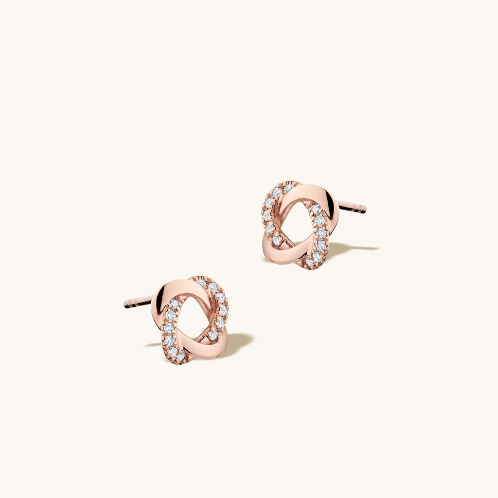 Angled view of Jewellers District's Twisted Diamond Pavé Studs in 10k Rose Gold