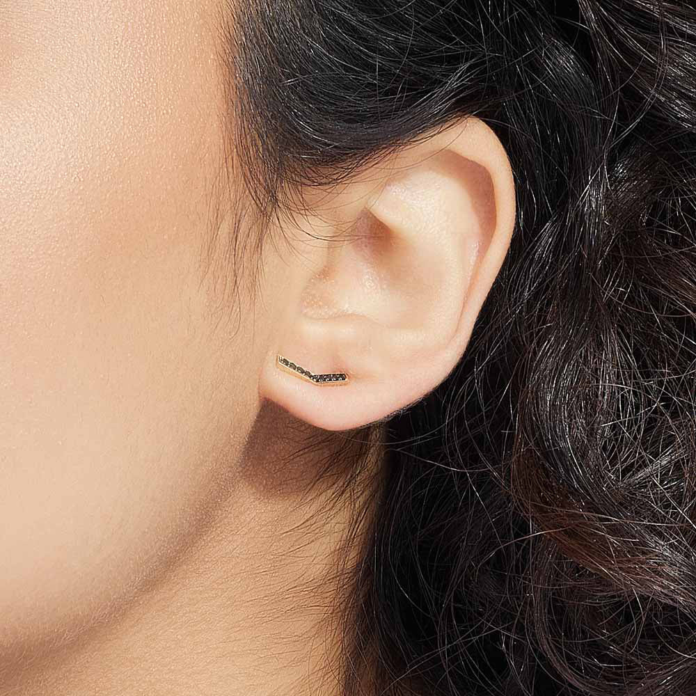 Model wearing Jewellers District's V-Shaped Stud Earrings with Accent Black Spinels in 14k Yellow Gold #2