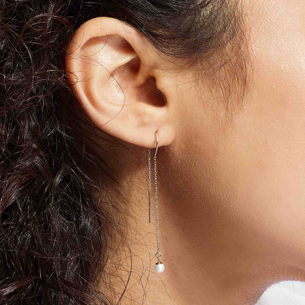 Model wearing Jewellers District's Freshwater Pearl Threader Earrings in 14k Yellow Gold #2