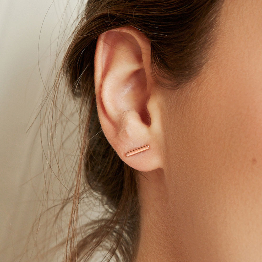 Model wearing Jewellers District's Gold Bar Stud Earrings in 10k Rose Gold #3