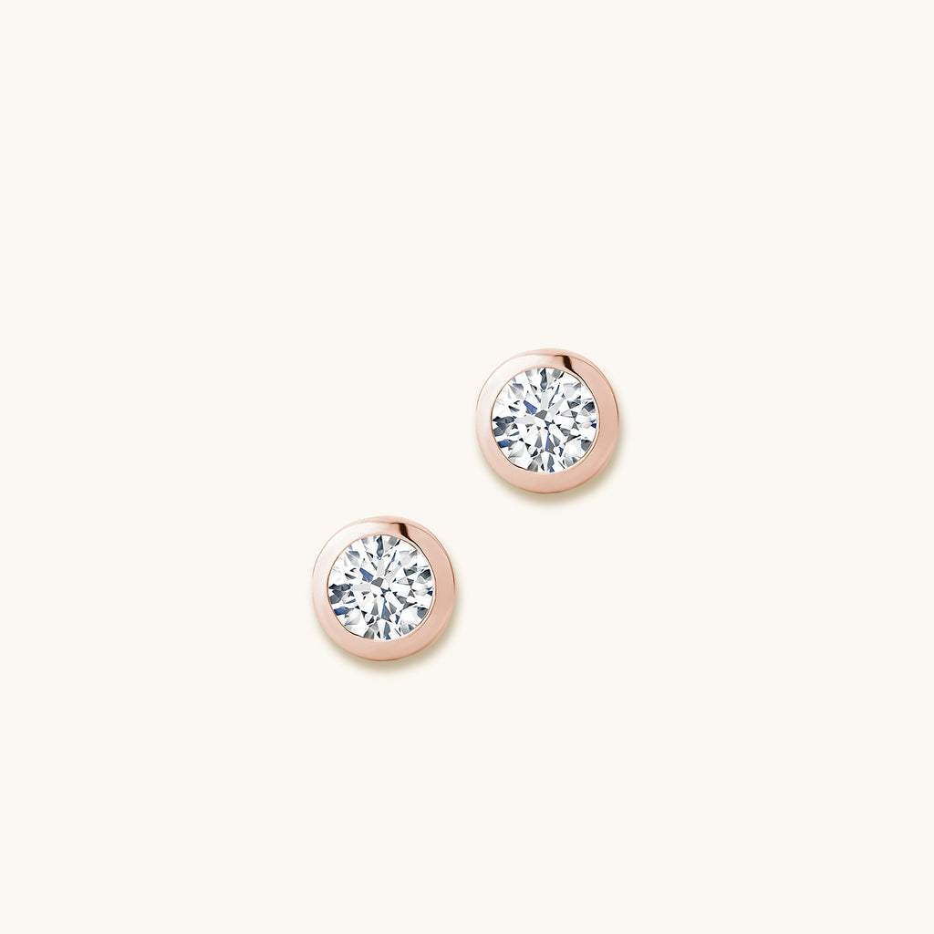 Face view of Jewellers District's Bold Bezel-Set Round Cut Diamond Studs in 14k Rose Gold