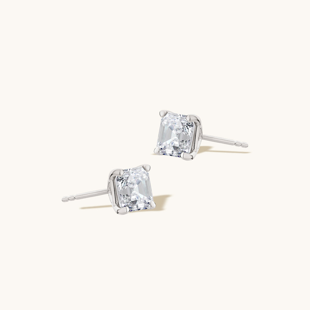 Angled view of Jewellers District's Asscher-Cut Diamond Stud Earrings in 14k White Gold, Lab-grown 1.40 ctw, VS2+/ F+