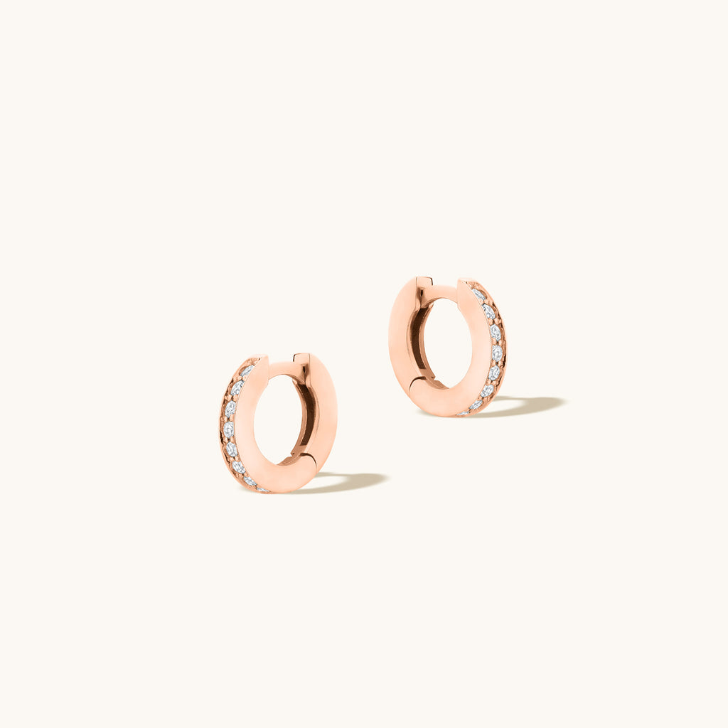 Angled view of Jewellers District's Diamond Hoop Earrings with Bright-Cut Setting in 10k Rose Gold